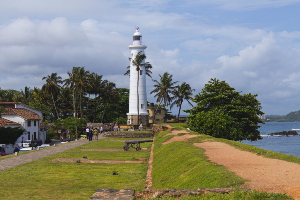 Explore the scenic beauty of Galle Lighthouse on the coast of Sri Lanka, capturing the essence of travel and architecture.